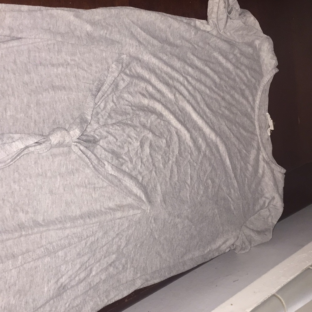 A gray cover up with knot at the bottom